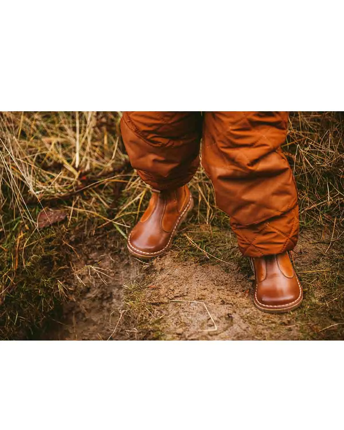 Pom Pom Chelsea Boots